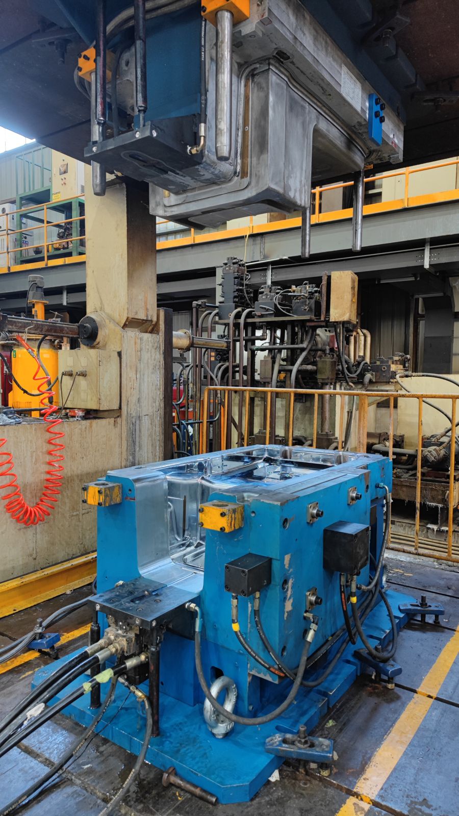 PDCPD mold mounted on a RIM press for trial molding